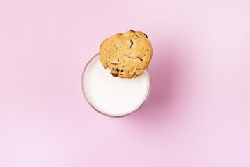 Glass of Milk and Cookie Horizontal Top View Pink Background