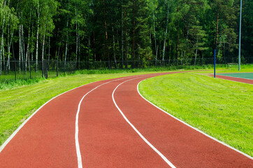 Red rubber running track in a stadium