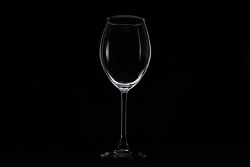 Empty glass for water, juice or milk on a dark background. Symbol of thirst. Close up.