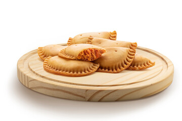 Empanadillas de atun sobre tabla de madera. Tuna dumplings on wooden board
