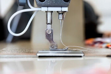 Sewing machine with white thread