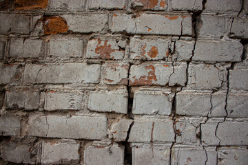 Old stone wall with cracks background