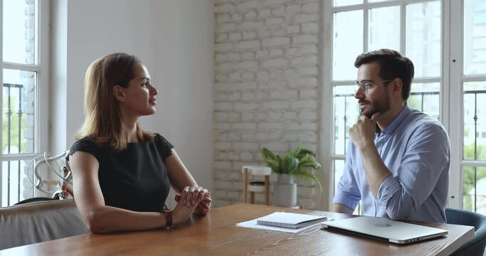 Male hr manager employer recruiter interviewing young female job applicant handshaking client thanking making business agreement at hiring negotiations, human resource, respect and recruiting concept