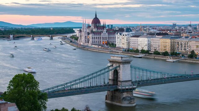 Time lapse with amazing view of Budapest with Parliament building, Chain bridge and Danube river at sunset.