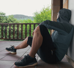 Young man in sportswear with hood on © Aiari