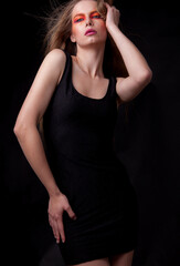 Fototapeta premium Young beautiful stylish girl posing in studio.