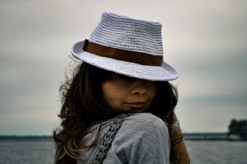 young woman in a hat