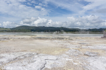 Public access to sulfur producing geothermal pools can be found at Kuirau Park. The ground steams with boiling water ready to spew geysers into the air. 