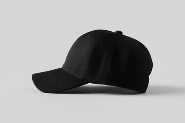 Black baseball cap mockup on a grey background, side view.