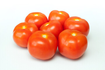 Fresh tomatoes on the white background. 