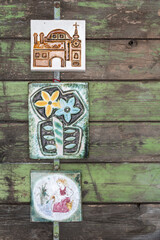 Ceramic wall hangings on green wooden background - mid-century modern decoration