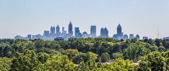 Downtown Atlanta Skyline showing several prominent buildings and hotels under a blue sky as seen...