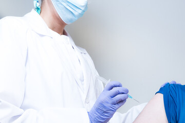 nurse administering vaccine