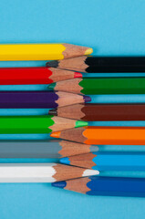 colored pencils on blue background