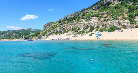 Man swims to Tsambika beach (RHODES, GREECE)