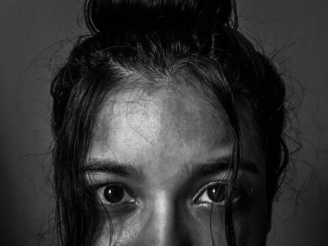 Humble woman with a look af hope - the face of war - strong girl - woman's courage - the hope in a dark look
