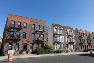 Row of Old Brick Residential Buildings along an Empty Street in Astoria Queens New York