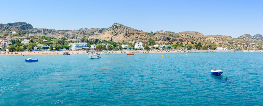 Panoramic view of Stegna beach with anchored small boats (RHODES, GREECE)