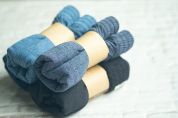 Pile of stock of dark blue and dark men underwear rolled folded