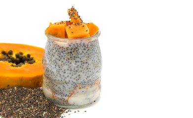 Healthy dessert. Chia Pudding with Fresh Papaya in jar on white background. Clean eating concept, healthy vegetarian food. Ingredients superfood. Space for text. side view. Lactose free