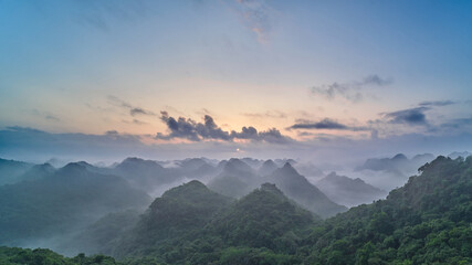Panoramic view of the CatBa National Park, Vietnam. View from the top of the jungle hills of karst cliffs at dawn.
