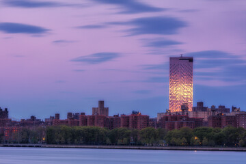 Fototapeta premium View on Downtown Manhattan From East river with long exposure during sunrise