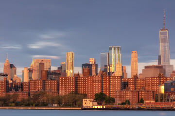 Fototapeta premium View on Lower East from East river with long exposure at sunrise