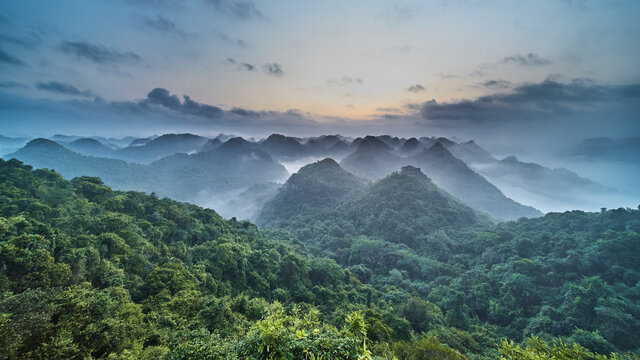 Panoramic view of the CatBa National Park, Vietnam. View from the top of the jungle hills of karst cliffs at dawn.
