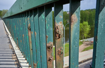 Rusty bridge fence in the city