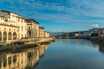 Fototapeta na wymiar FLORENCE, TUSCANY / ITALY - DECEMBER 27 2019: Arno river photo in Florence city