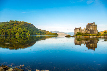Fototapeta na wymiar Reflection of Eilean Donan Castle in the morning - Dornie, Scotland - United Kingdom