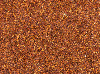 Rooibos tea background. Rooibos, traditional beverage in South Africa. Organic tea. Top view. Close up.