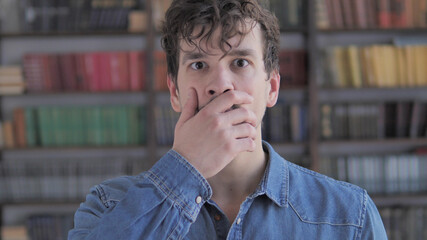 Portrait of Amazed, Surprised Casual Young Man Wondering