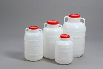 Plastic white water barrel, with red lid, container, for liquids, on a white background, online store