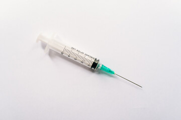 Syringe on a white background.