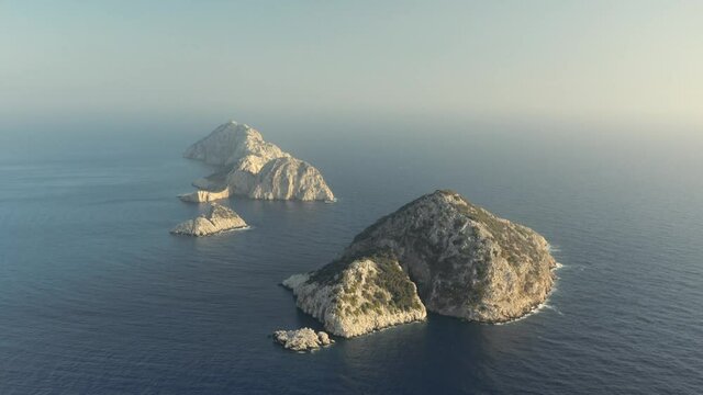 Desert Greek islands in the Mediterranean sea. Aerial Footafe 4K. Amazing landscape of Greece 