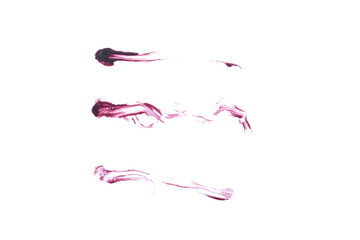 Lipgloss smear samples isolated on a white background. Dark red soft focus makeup texture