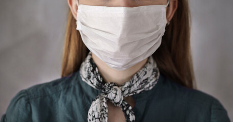 Young woman wearing medical mask	
