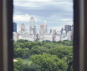 Central Park and Manhattan Upper East Side seen through a window, New York City, USA.