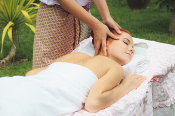 Obraz na płótnie Canvas Beautiful women resting relaxing in spa. Masseuse is massaging the head.