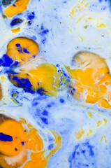 Abstract crazy mix of blue paint, egg yolks and egg whites. 