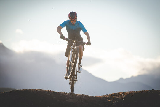 Close Up Image Of A Mountain Biker Speeding Downhill On A Mountain Bike Track