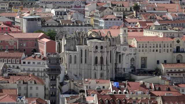 Lisbon cityscape with the Carmo Convent & Santa Justa Lift from the St. George Castle viewpoint (Miradouro do Castelo de Sao Jorge). Portugal