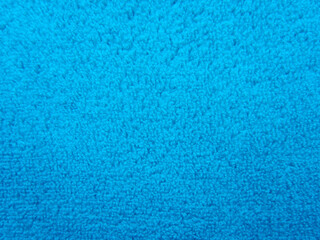 Fototapeta na wymiar Blue pile fabric draped with pleats. Fabric made from natural fibers.