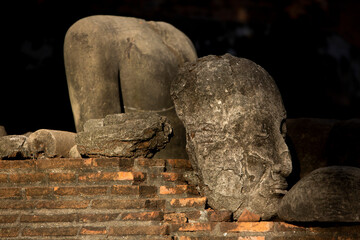 Old and damaged Buddha at Wat Ratchaburana, Phra Nakhon Si Ayutthaya thailand