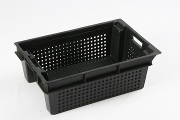 Black plastic box, container for storing and transferring fruits and vegetables, food, for storing things on a white background, online store