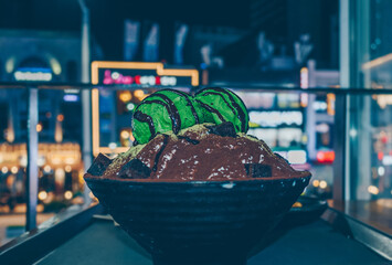 green tea bingsu with night cityscape view
