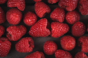 raspberry on a dark wooden background
