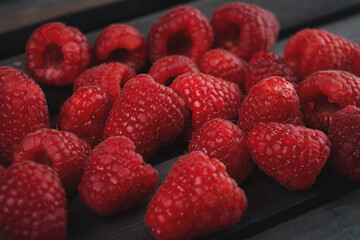 raspberry on a dark wooden background

