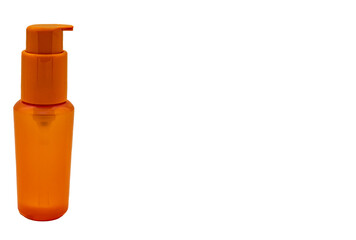 Plastic orange container for cosmetics isolate close-up